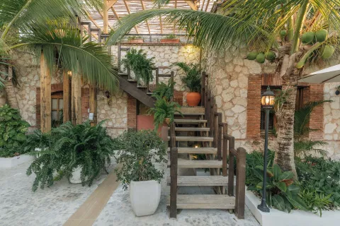 Tropical courtyard and stairway at Hotel Casa Don Luis in Cap Cana