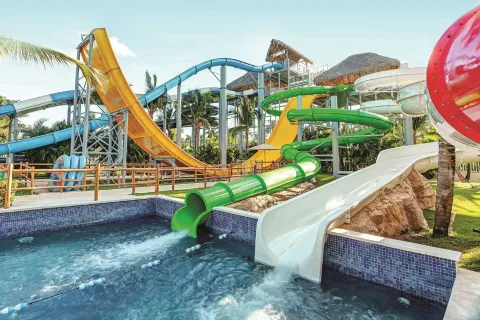 Large green, yellow and white waterslides at Royalton Splash Punta Cana